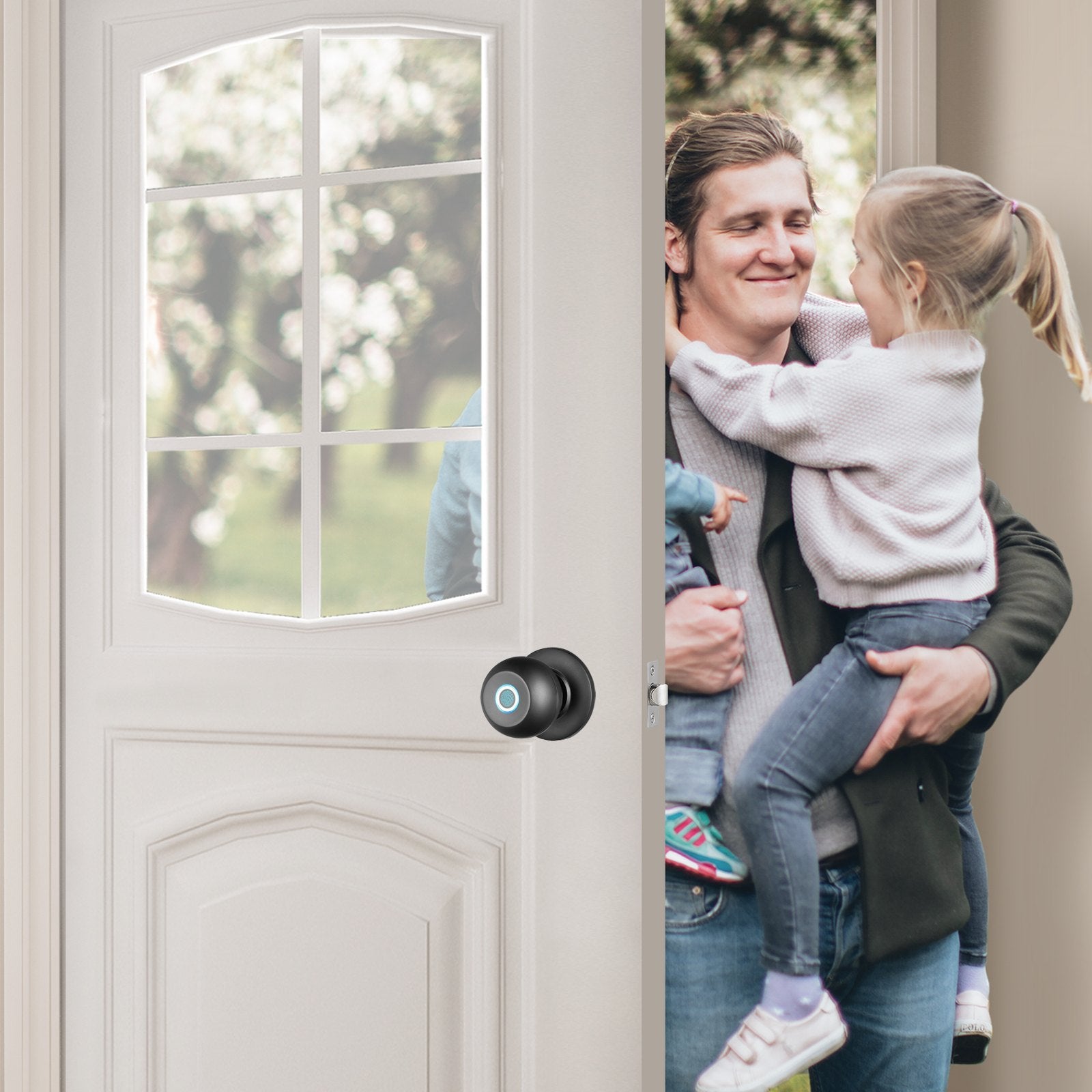 Man holding a child in front of a door with a smart lock handle.
