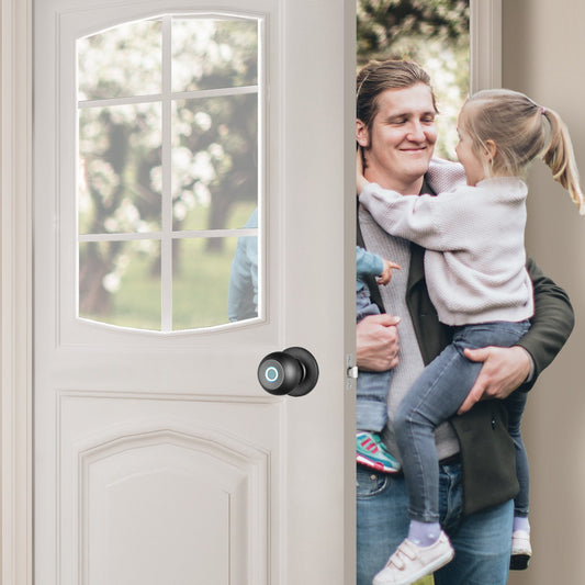 Man holding a child in front of a door with a smart lock handle.
